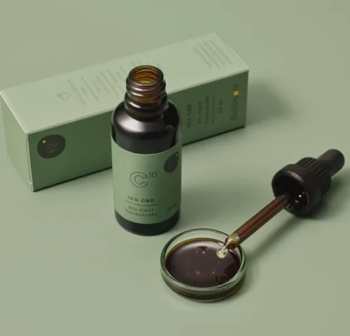 Naturalne krople CBD – butelka z pipetą i opakowaniem, pełne spektrum kannabinoidów z certyfikatem jakości.